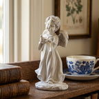 Allegra Cherub Holding Bird Sculpture